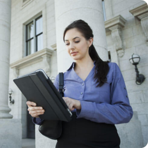 A public sector woman examines her B2B marketing opportunities